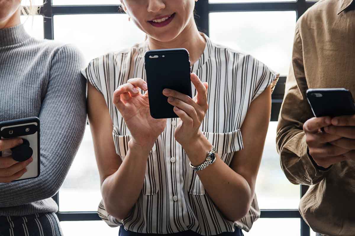 Woman looking at her mobile phone and smiling